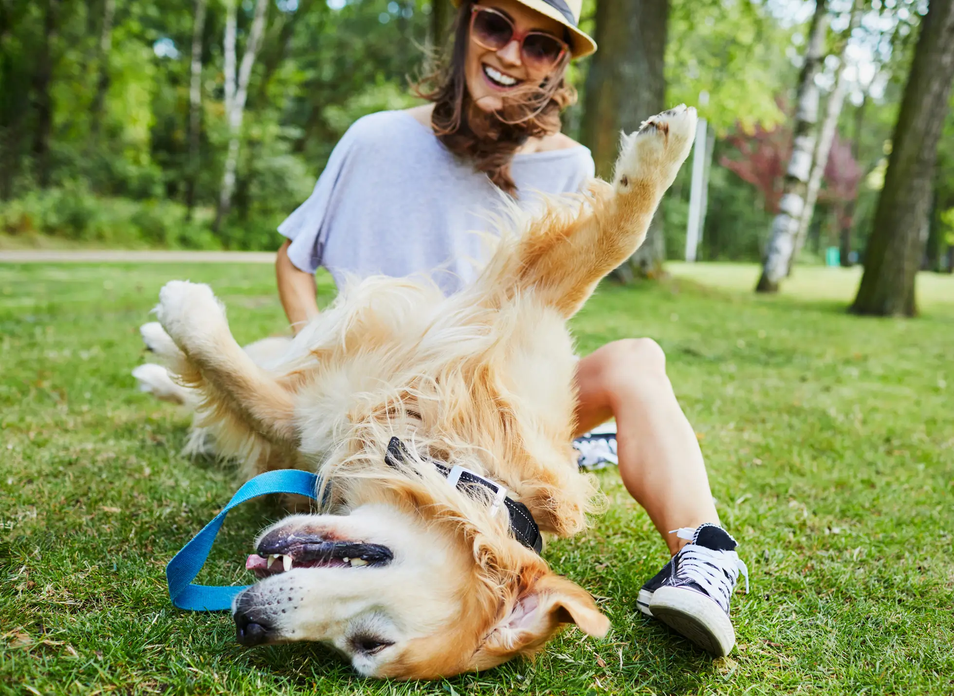 young woman playing with a dog
