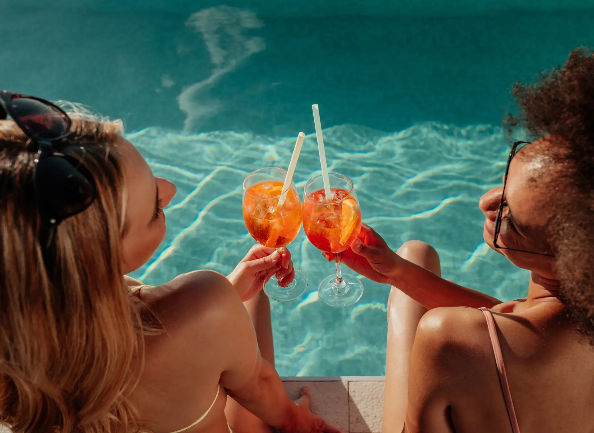 two young women enjoying cocktails